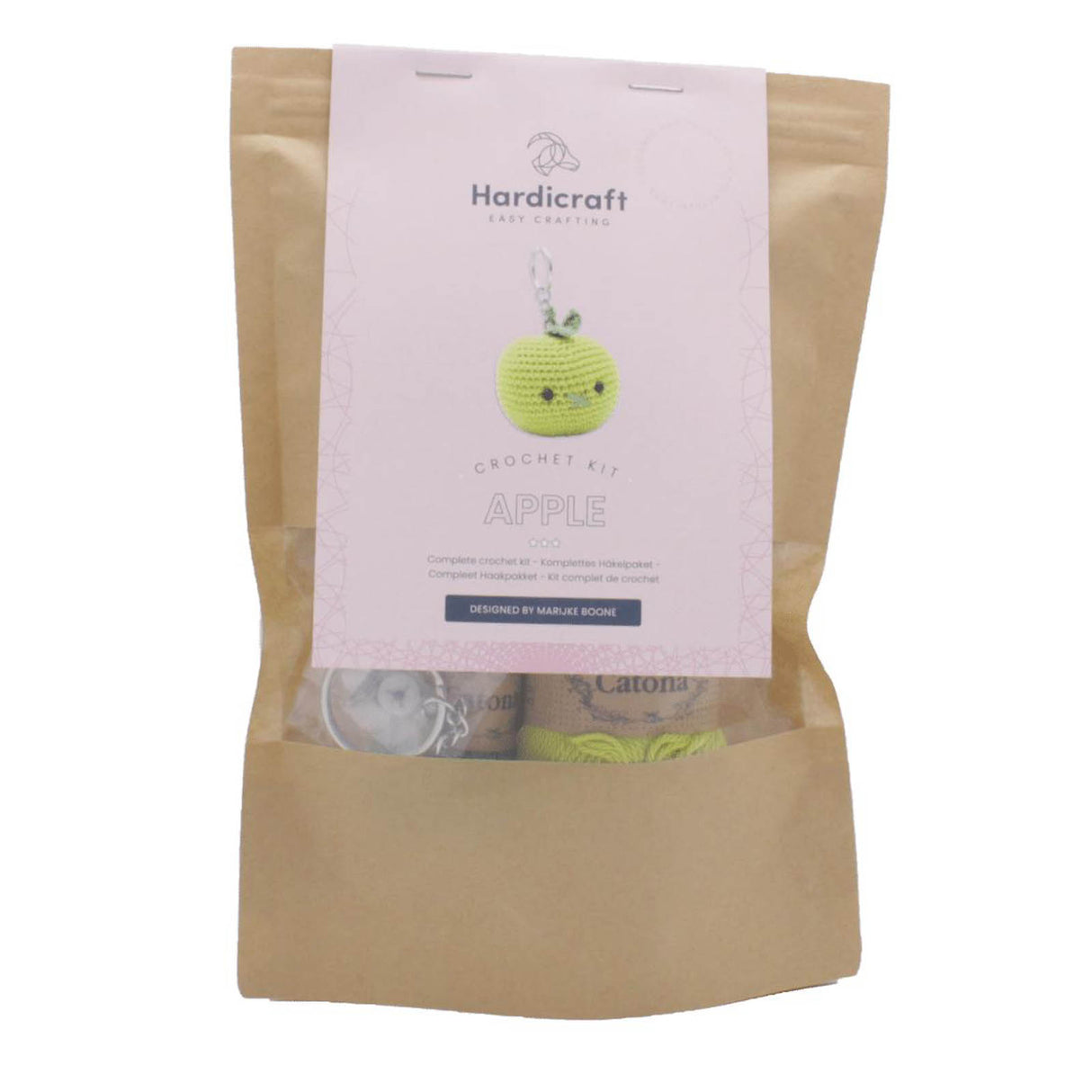 Hardicraft Häkelset Apfel in brauner Papiertüte mit Produktetikett