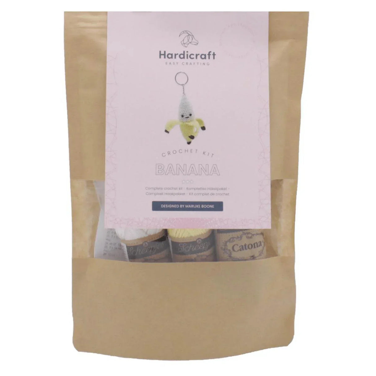 Hardicraft Hakelset Banane in brauner Papiertuete mit Garnknaeueln