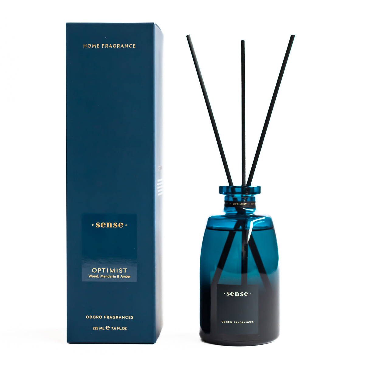 Blauer Raumduft Diffusor mit schwarzen Stäbchen und passender Verpackung