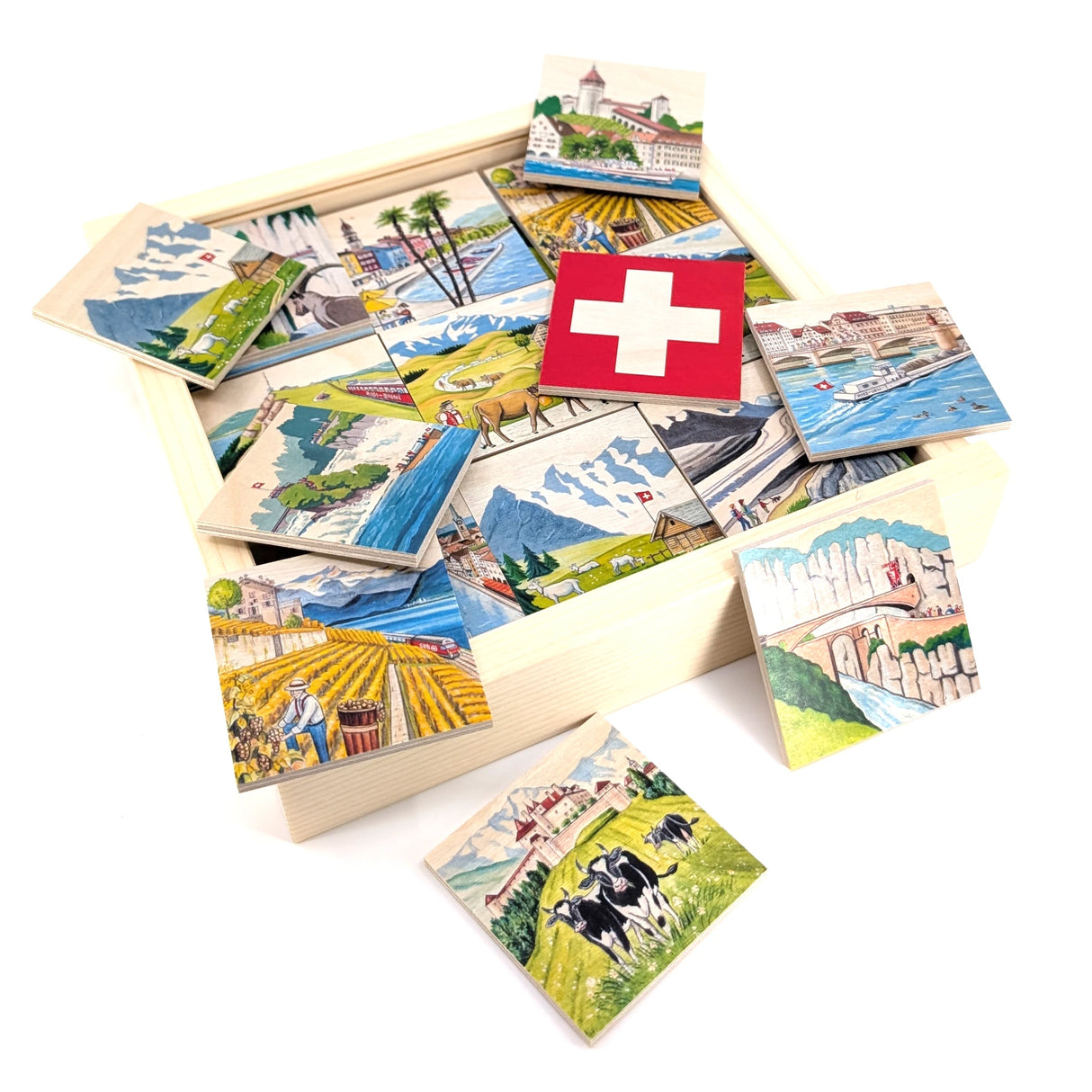 Holzkiste mit Schweizer Puzzles, die verschiedene Landschaften und Sehenswürdigkeiten zeigen