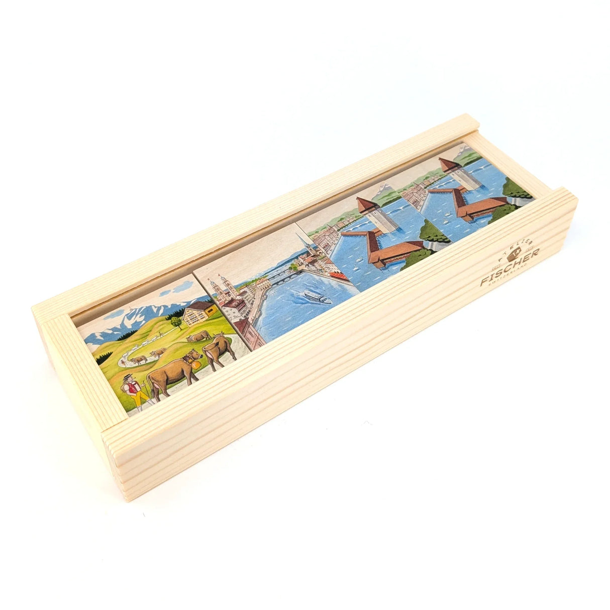 Holzkiste mit drei Bildern: Hirte mit Kühen, Stadtansicht mit Fluss und Boot, Kapellbrücke Luzern
