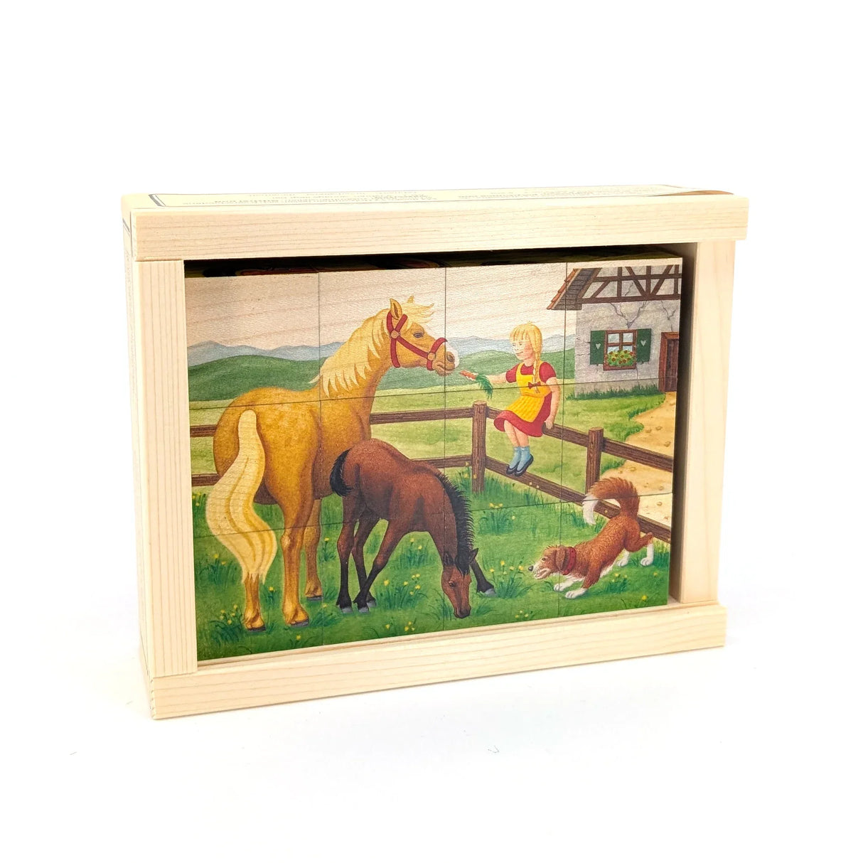 Holzpuzzle mit Bauernhofmotiv, Pferd, Fohlen, Mädchen und Hund vor einem Haus