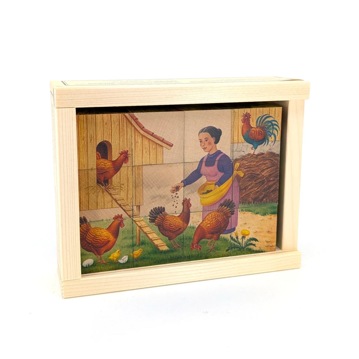 Holzpuzzle mit einer Frau, die Hühner, Küken und einen Hahn auf einem Bauernhof füttert