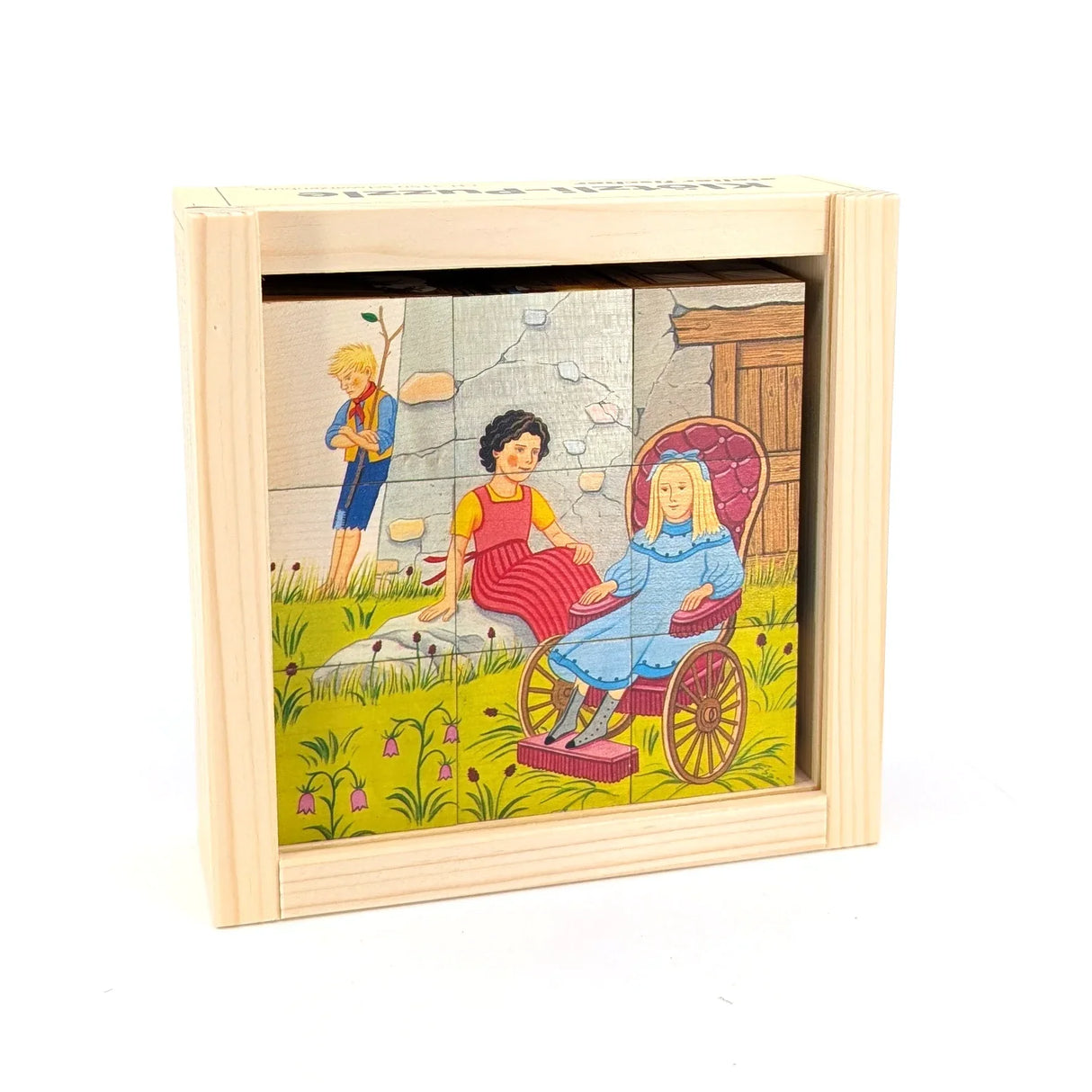 Holzpuzzle mit drei Kindern, eines im Rollstuhl, vor einer Steinmauer und Blumen