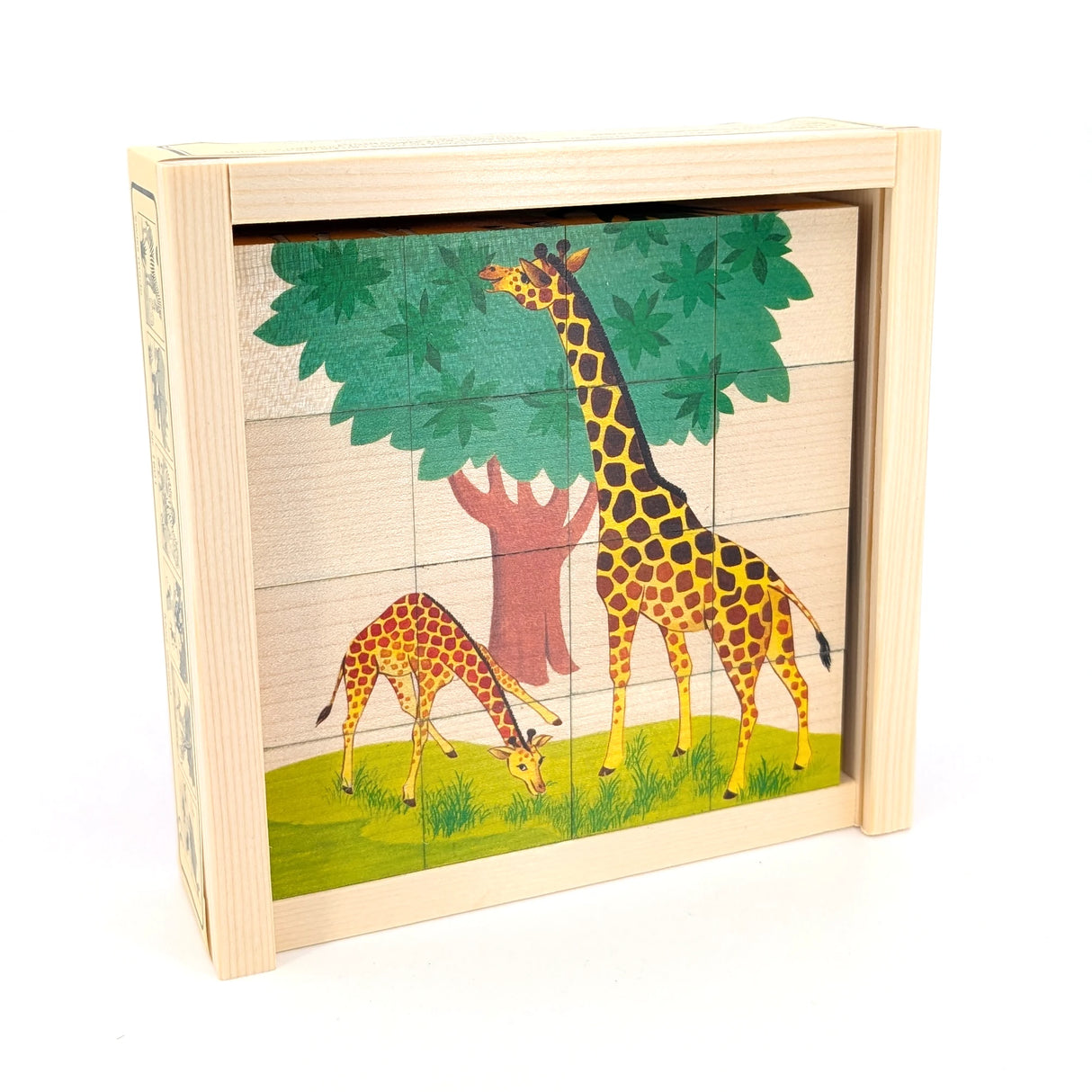 Holzpuzzle mit zwei Giraffen unter einem Baum auf einer Wiese