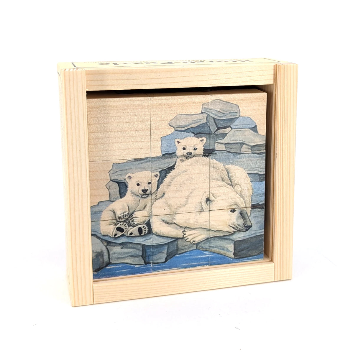 Holzpuzzle mit Eisbärenfamilie auf Felsen im Wasser