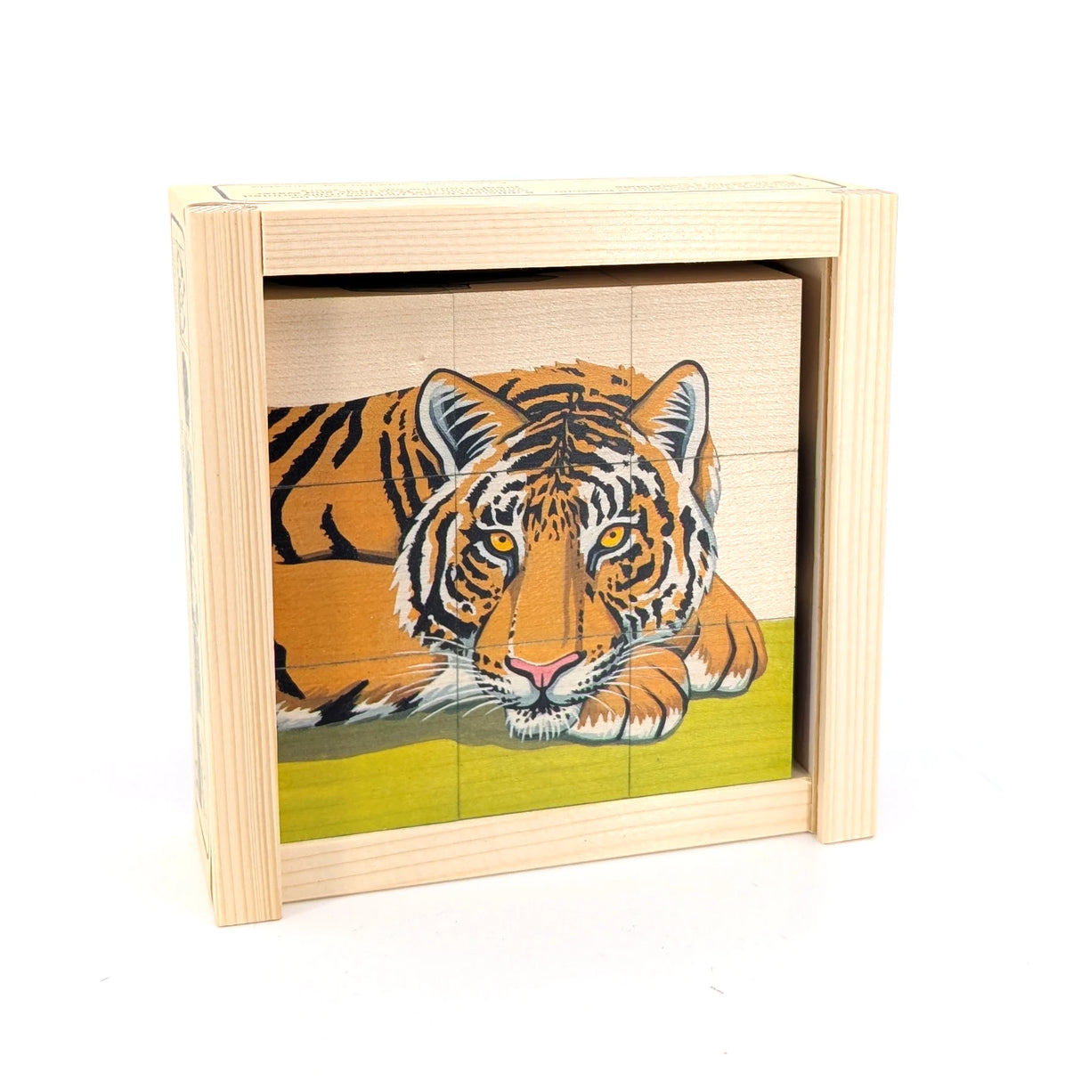 Holzpuzzle mit einem Tiger auf grünem Hintergrund