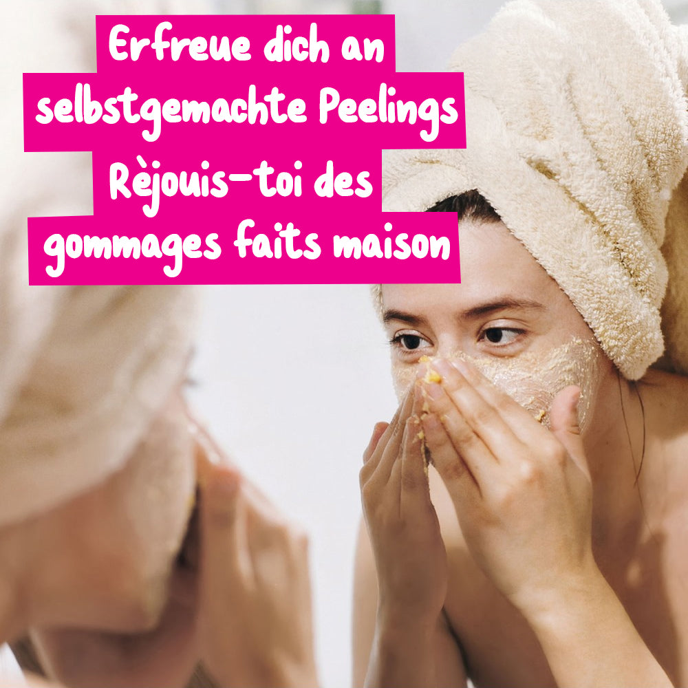 Frau mit Handtuch auf dem Kopf trägt ein Peeling auf ihr Gesicht auf