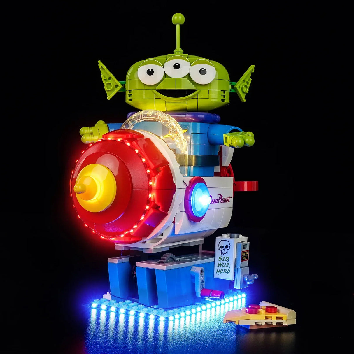 LEGO Toy Story Alien auf Pizza Planet Rakete mit BrickBling LED-Lichtset, beleuchtetes Münzprüfer-Detail „Sid wuz here“ und blau strahlende LED-Bodenplatten.