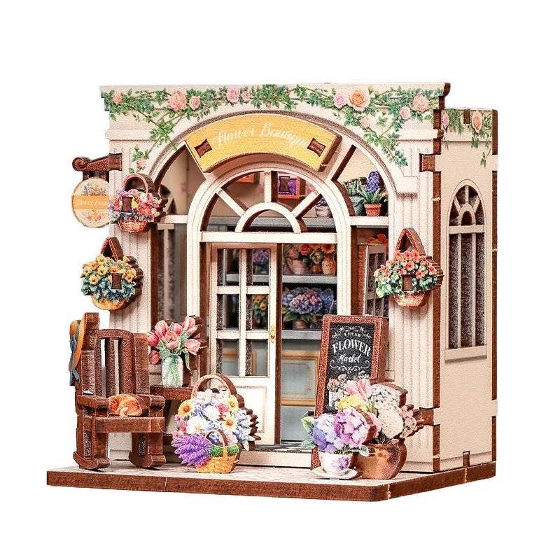 Miniatur-Blumenladen mit Blumenkörben, Schaukelstuhl und Kreidetafel