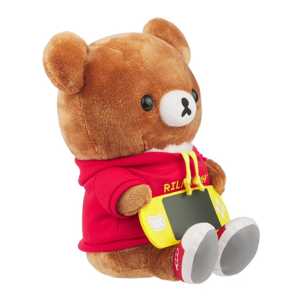 Rilakkuma Plüschtier in rotem Hoodie hält gelbe Spielkonsole
