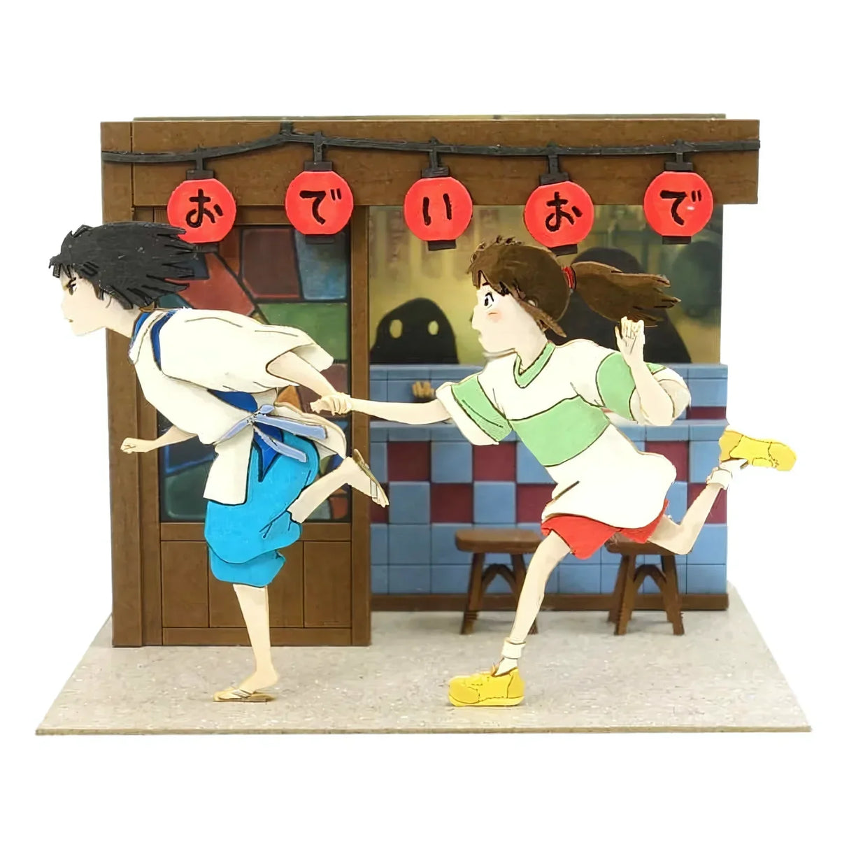 Haku und Chihiro rennen vor einem Gebäude mit roten Laternen