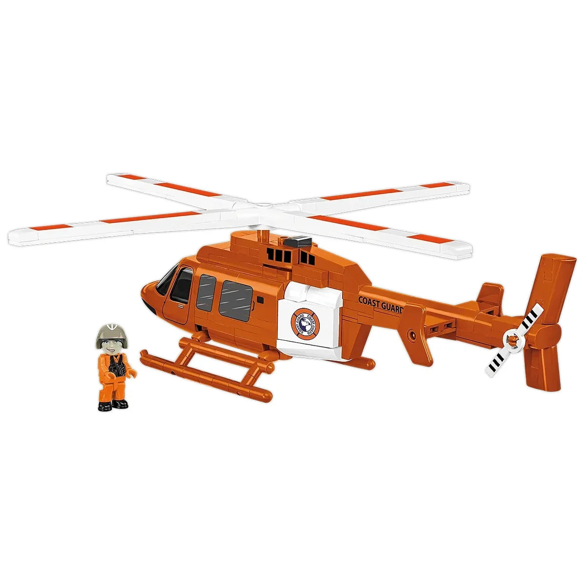 Orangefarbener Spielzeug-Hubschrauber der Küstenwache mit einer kleinen Figur daneben