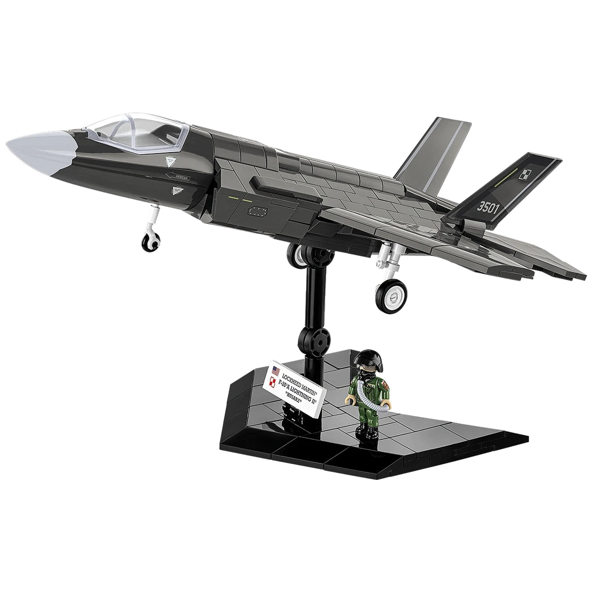 Modell eines Lockheed Martin F-35A Lightning II Flugzeugs auf einem Ständer mit einer Pilotenfigur