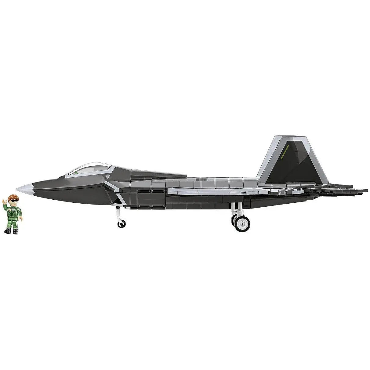 Graues Spielzeug-Kampfflugzeug mit einem Piloten als Spielfigur daneben