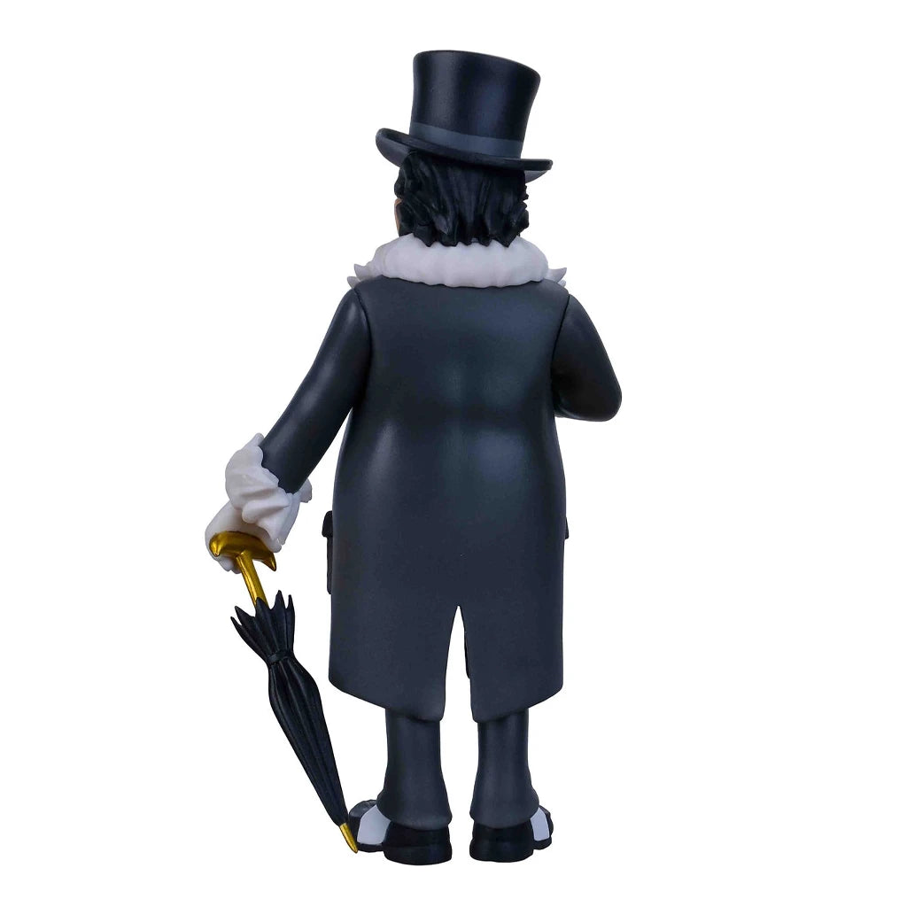 Rückansicht einer Pinguin-Figur mit Zylinder, Mantel und Regenschirm