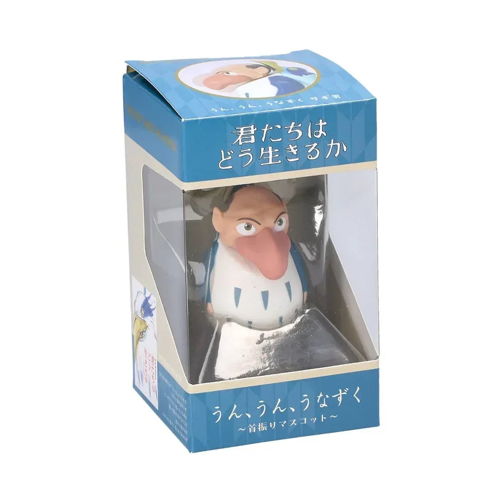 Sammelfigur des Reihermanns in einer bedruckten Pappschachtel mit Sichtfenster