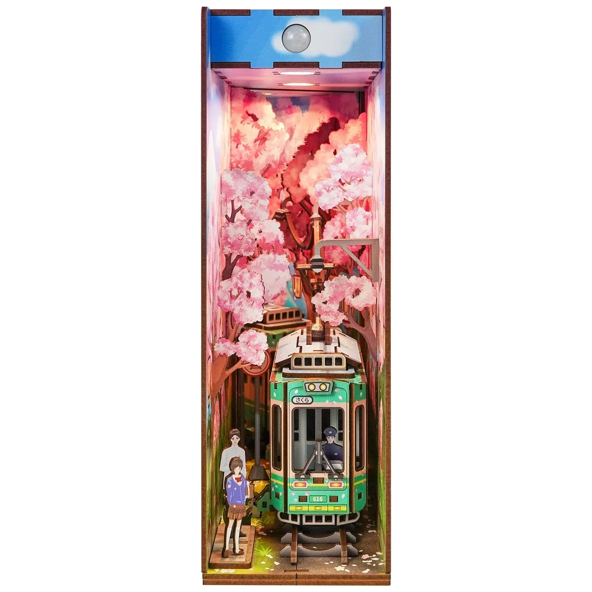 Miniatur-Bücherregal-Einsatz mit Kirschblüten, Straßenbahn und zwei Personen