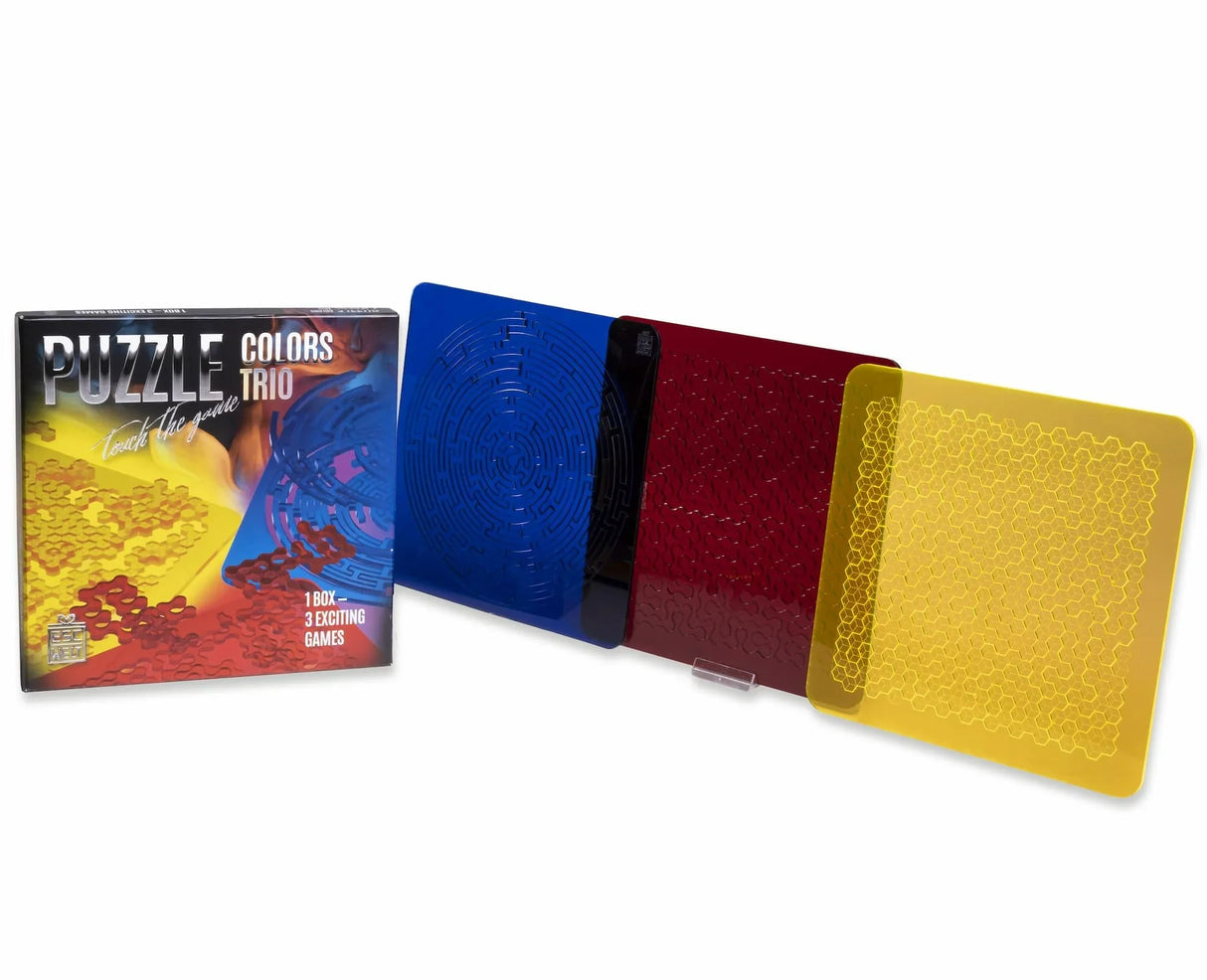 Das komplette Puzzle Colors Trio Set mit der Produktbox und den drei quadratischen Acryl-Puzzles in den Farben Blau, Rot und Gelb.