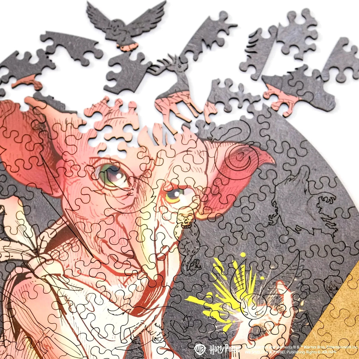 Dobby Puzzle mit fehlenden Teilen, die eine Eule und einen Hirsch zeigen