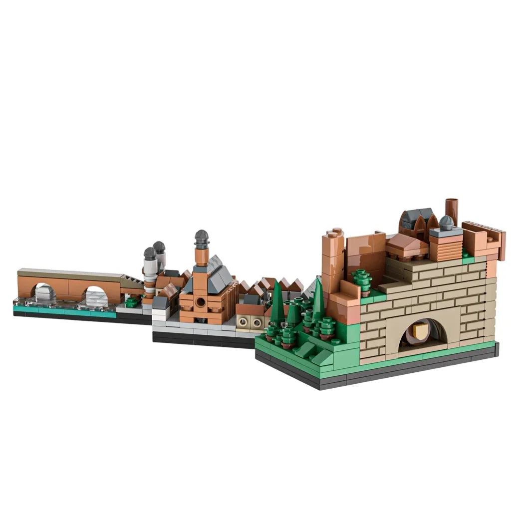 Ein Lego-Modell einer Stadt mit Brücke, Gebäuden und Bäumen