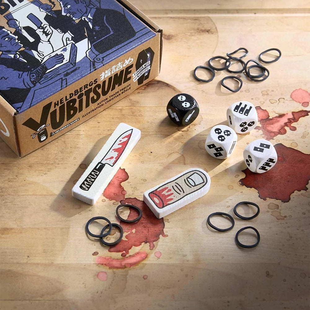 Yubitsume Brettspiel mit Würfeln, Gummibändern und Spielsteinen in Form eines Messers und Fingers