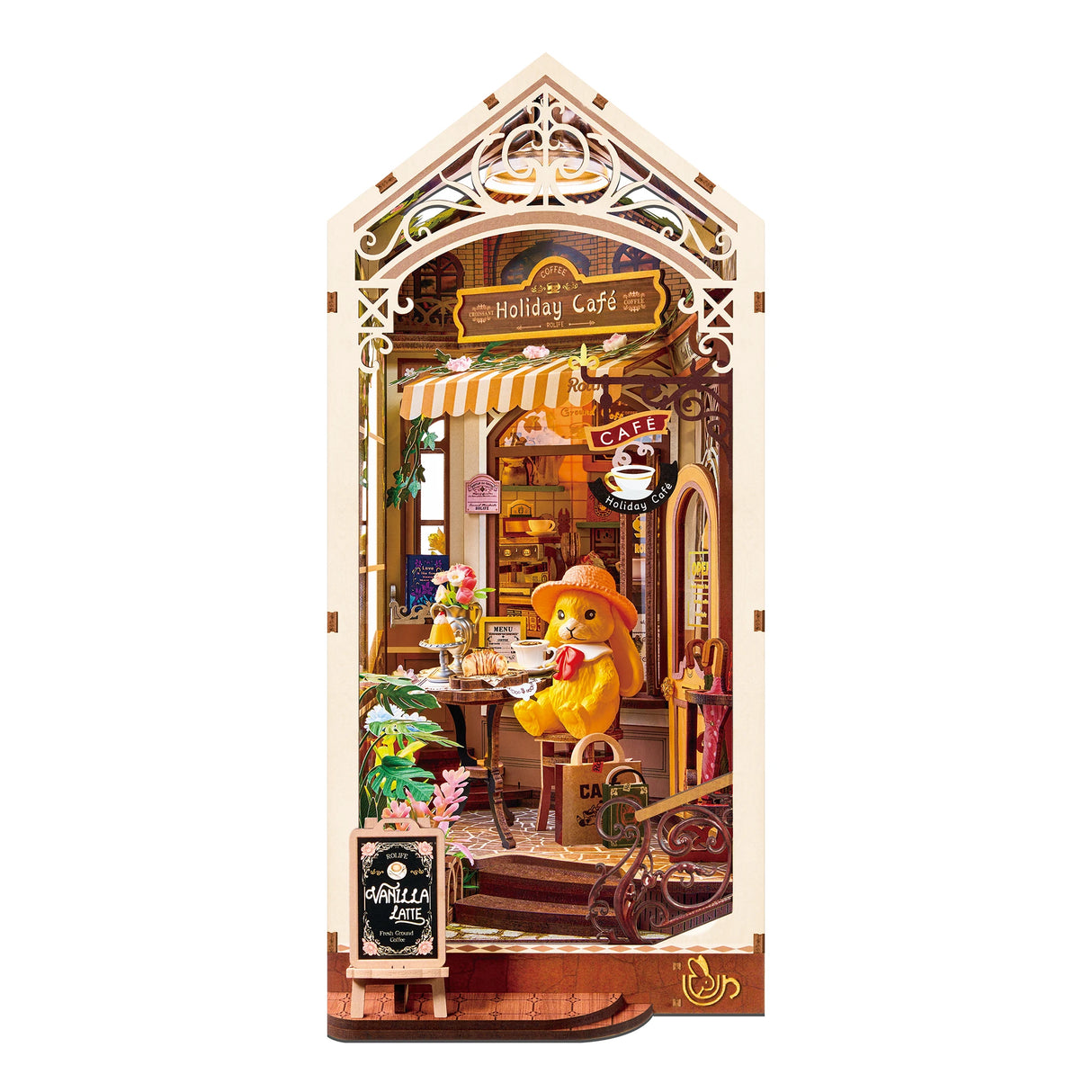 Miniatur-Café-Diorama mit einem Hasen in einem Strohhut, der an einem Tisch sitzt