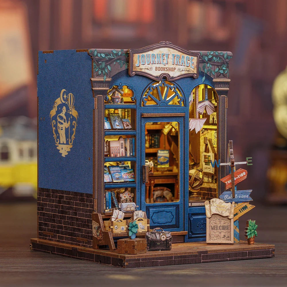 Miniatur-Buchhandlung mit beleuchtetem Inneren und Schildern davor