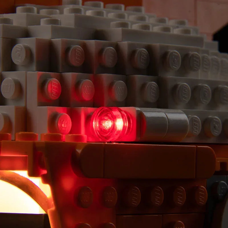 Nahaufnahme von grauen Lego Steinen mit einem leuchtend roten Lichtelement