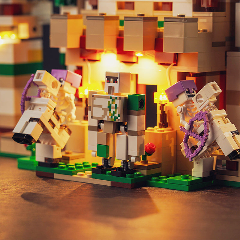 Minecraft Lego Set mit Eisengolem und zwei Skelettfiguren vor einer beleuchteten Festung