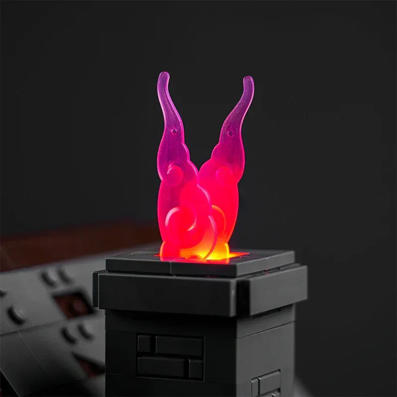 Pinke Flamme aus Kunststoff auf einem schwarzen Bausteinsockel