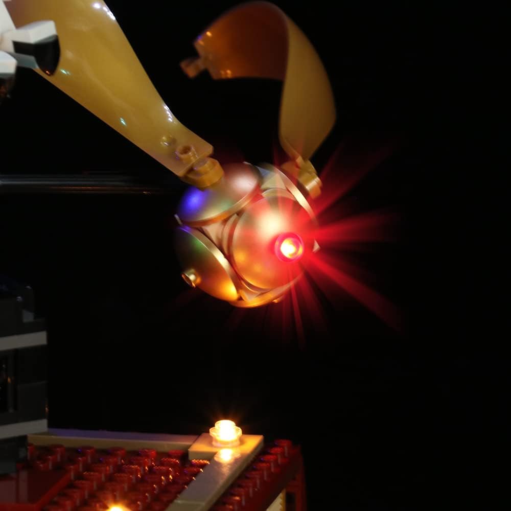 Goldene Kugel mit leuchtend rotem Licht vor schwarzem Hintergrund