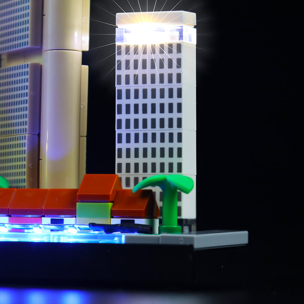 Beleuchtetes Lego Hochhaus Modell vor schwarzem Hintergrund