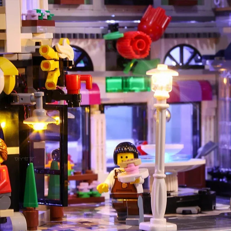 Beleuchtetes Lego Set mit einer Minifigur die einen Kuchen hält