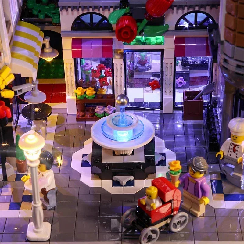 Beleuchtetes Lego Set mit Brunnen Blumenladen und Minifiguren