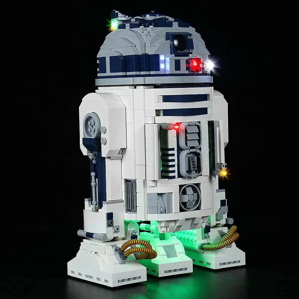 Beleuchtetes Lego Modell des Droiden R2-D2 vor schwarzem Hintergrund