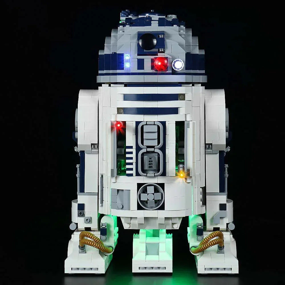 Beleuchtetes R2-D2 Modell aus Klemmbausteinen vor schwarzem Hintergrund
