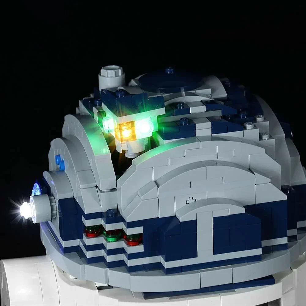 Beleuchteter Kopf eines R2-D2 Klemmbaustein Modells mit leuchtenden LEDs