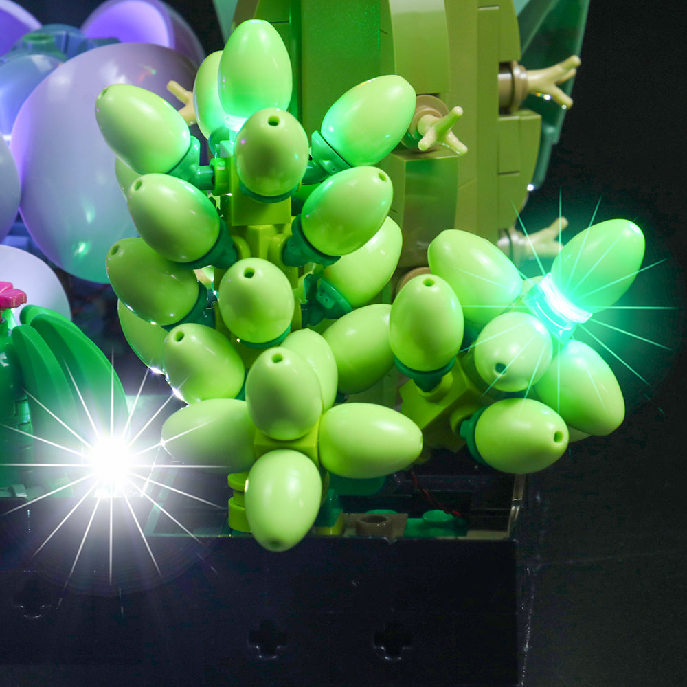 Beleuchtete grüne Baustein Pflanze mit leuchtenden Knospen