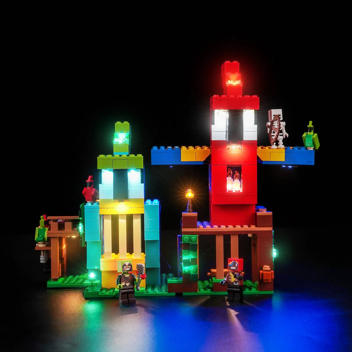 Beleuchtetes LEGO Minecraft Set mit zwei Türmen und Figuren auf schwarzem Hintergrund
