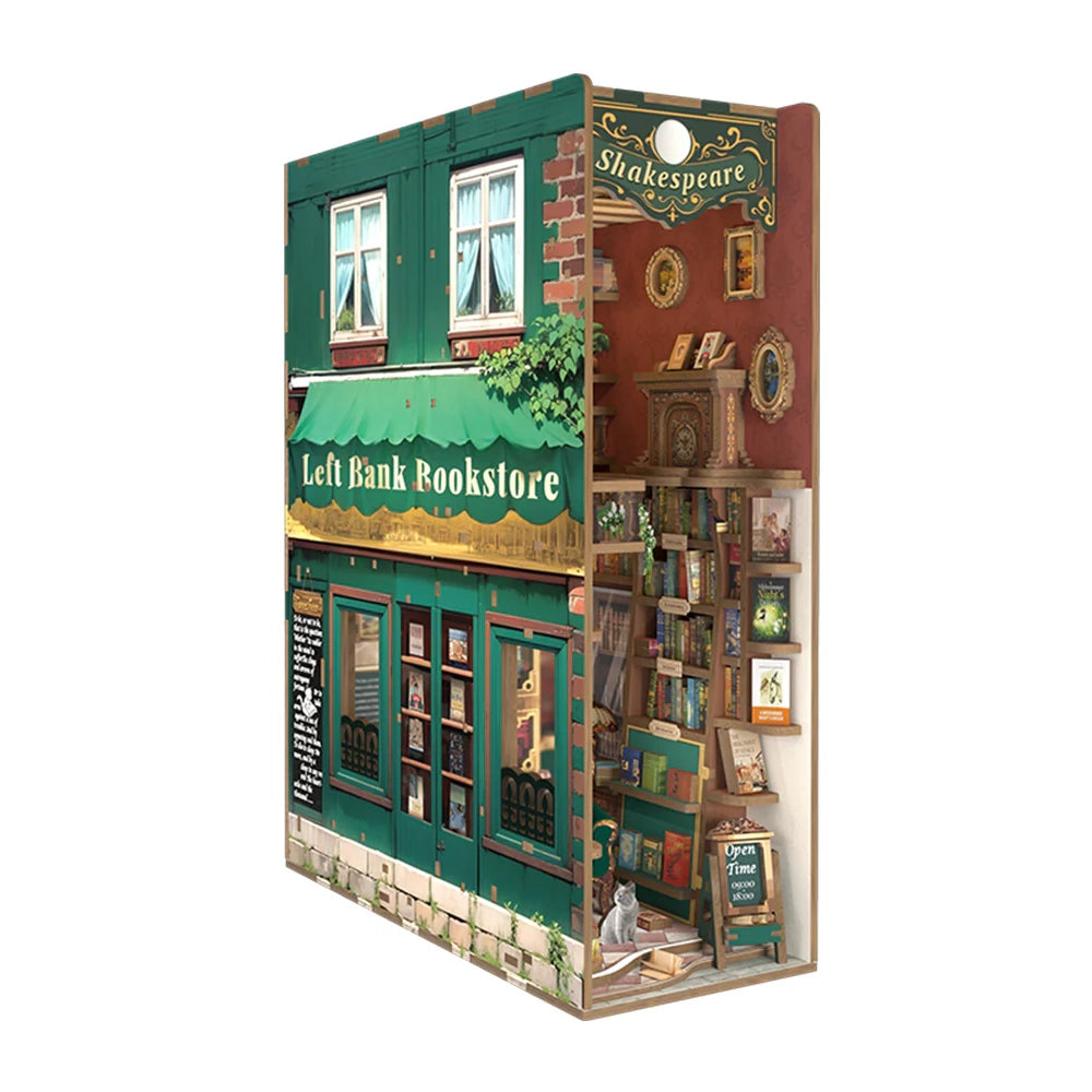 Miniatur-Buchhandlung mit grüner Fassade und Shakespeare-Regal