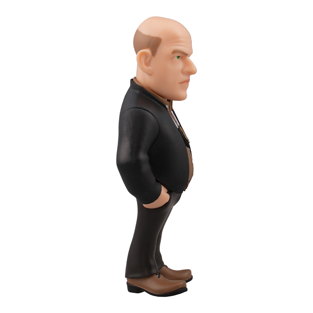 Figur eines Mannes mit Glatze, schwarzem Anzug und braunen Schuhen, von der Seite gesehen