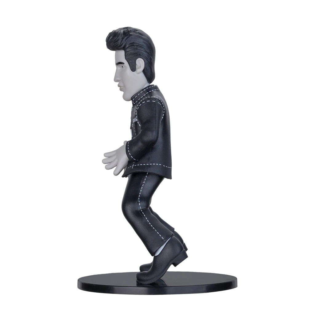 Schwarz weisse Elvis Presley Figur in Seitenansicht auf schwarzem Sockel