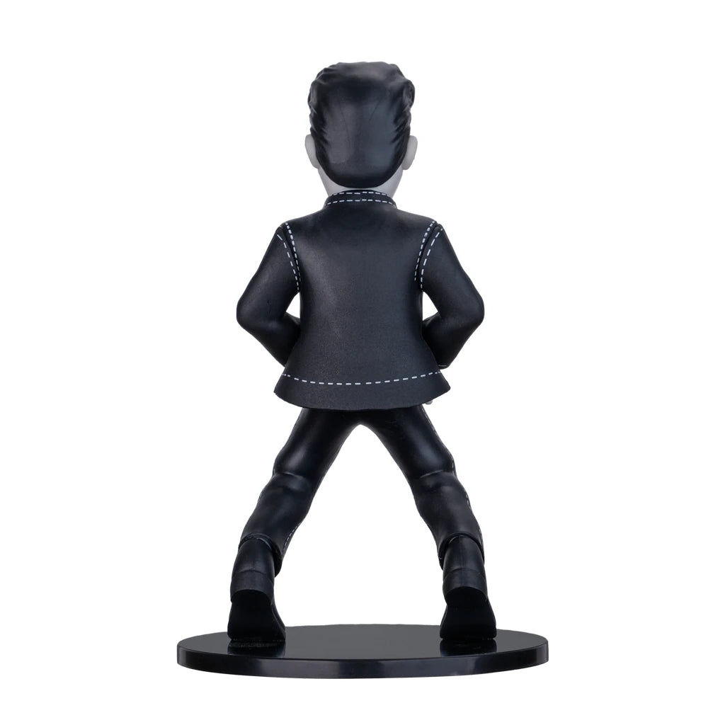 Rueckansicht einer schwarz weissen Elvis Presley Wackelfigur auf einem runden Sockel