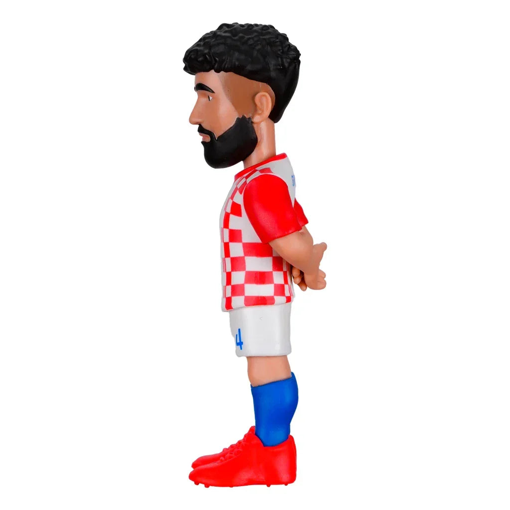 Fußballspieler-Figur mit Bart, kariertem Trikot, weißen Shorts, blauen Socken und roten Schuhen