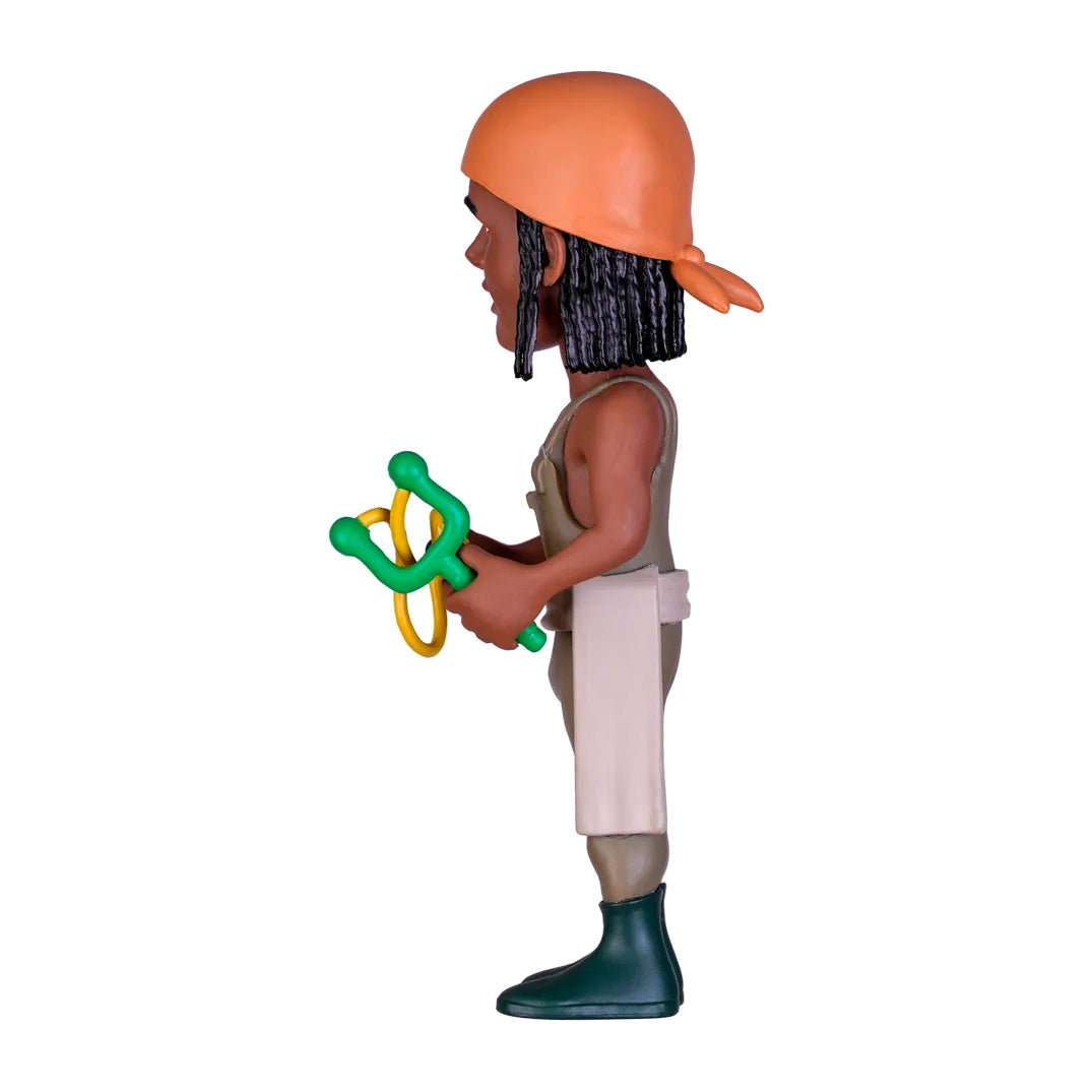 Spielfigur mit Kopftuch und Steinschleuder in der Seitenansicht