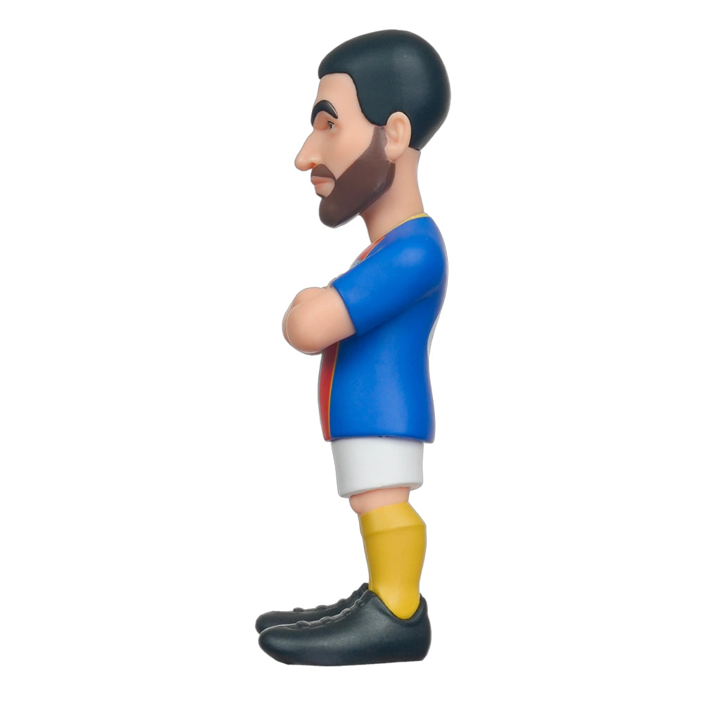 Fußballspieler-Figur mit Bart, blauem Trikot, weißen Shorts und gelben Socken