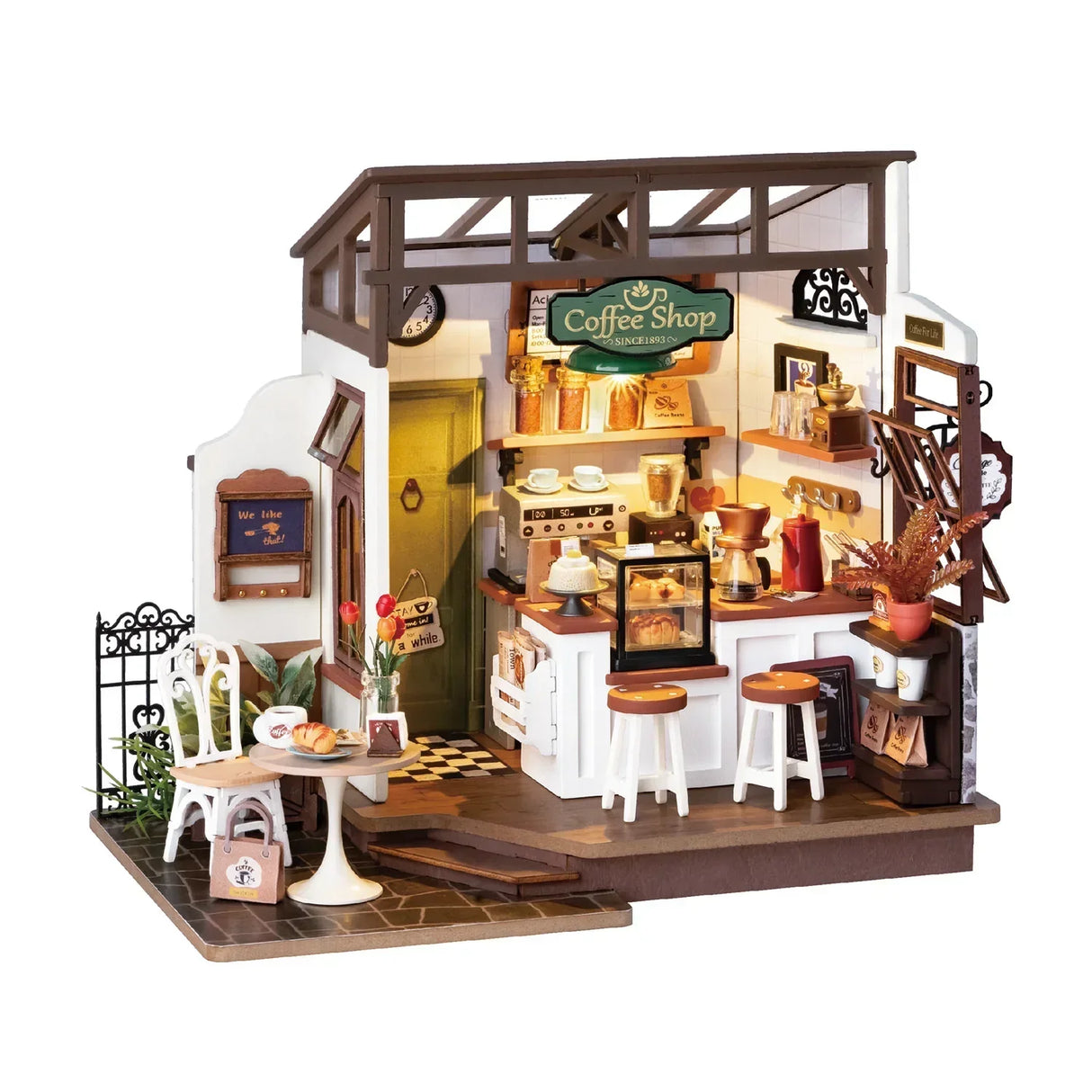 Miniaturmodell eines kleinen Cafes mit Theke Sitzgelegenheiten und Kaffeemaschine