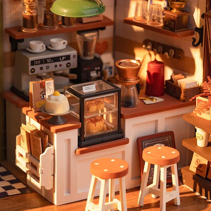 Miniaturmodell eines Cafes mit Theke Kaffeemaschine Gebäckvitrine und zwei Hockern