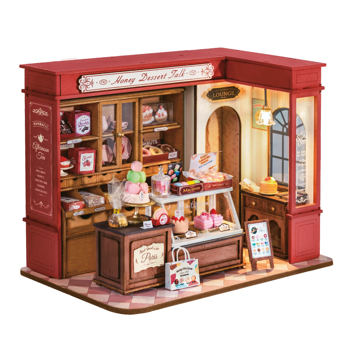 Miniatur-Puppenhaus-Bäckerei mit rotem Dach und vielen kleinen Desserts